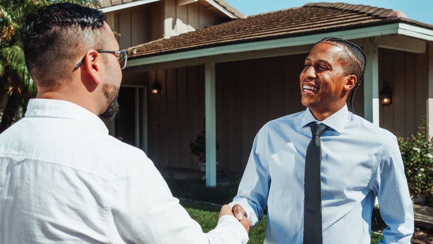 Realtor and client reviewing a property with peace of mind